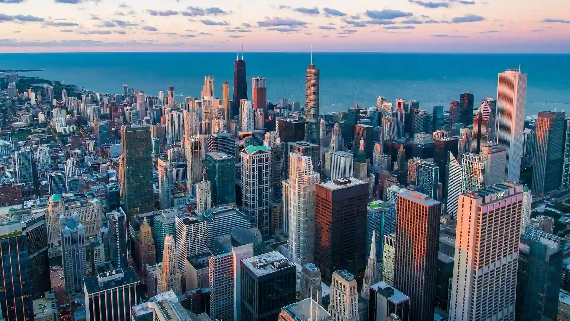 Aerial panoramic view of a city skyline showcasing booming business during sunset